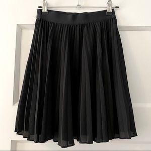 Babaton mini pleated skirt.